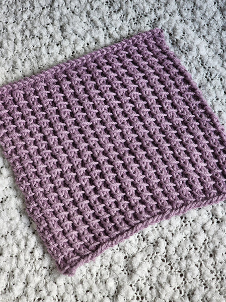 Quote from creator's blog post: A pretty braided cable dishcloth